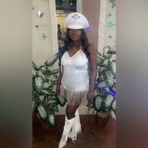 A white two piece fringe set. Worn once for about 3 hours